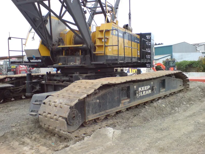 Crawler crane on its tracks at a construction site